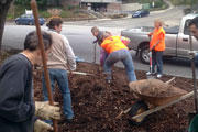 Volunteers spreading mulch during Cleanup Saturday event